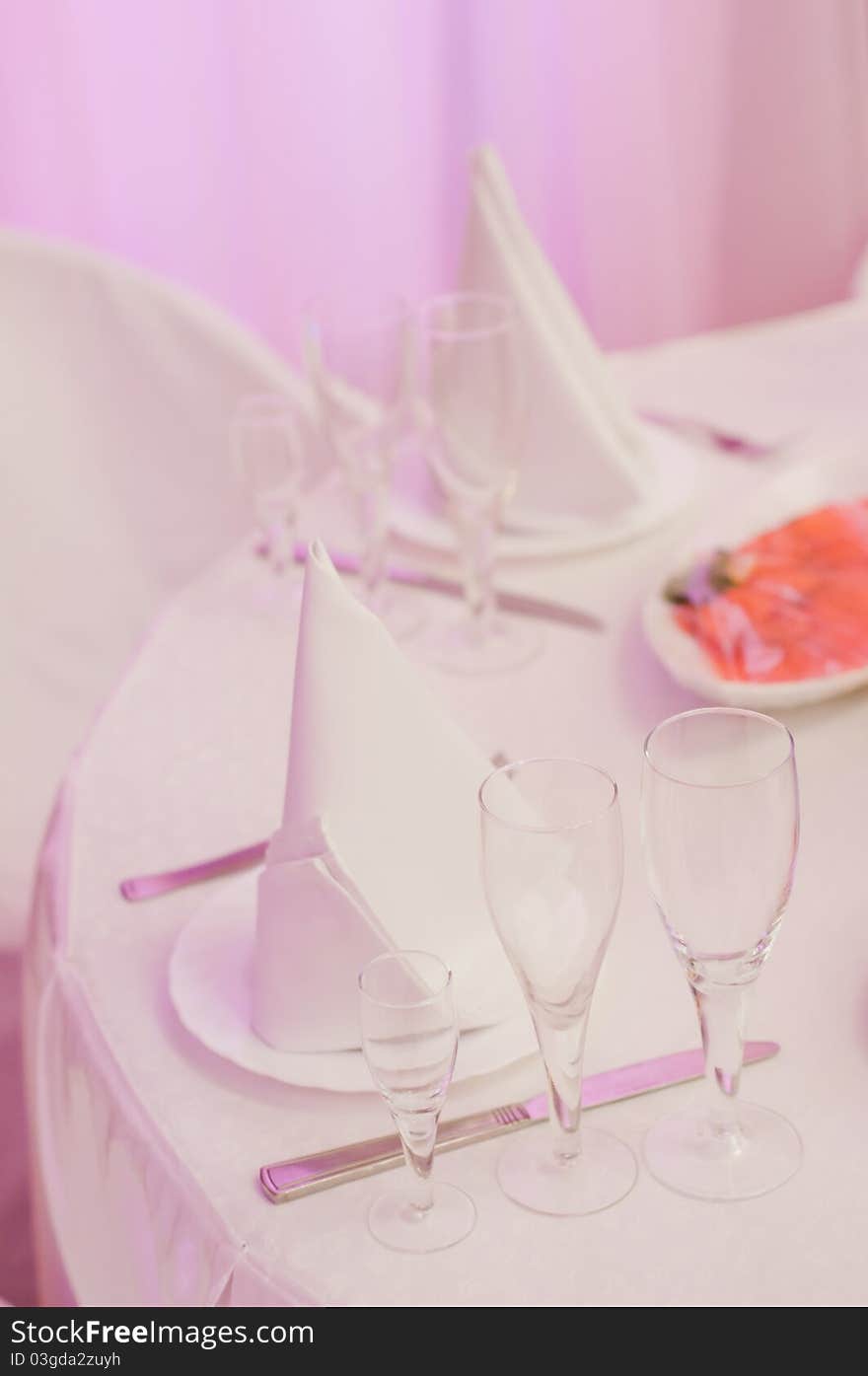 Closeup of banquet table in pink colors