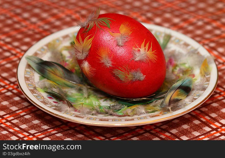 Dyed Easter egg for Easter is on a saucer