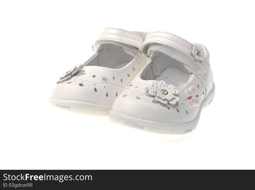 White summer shoes for the girl on a white background. White summer shoes for the girl on a white background