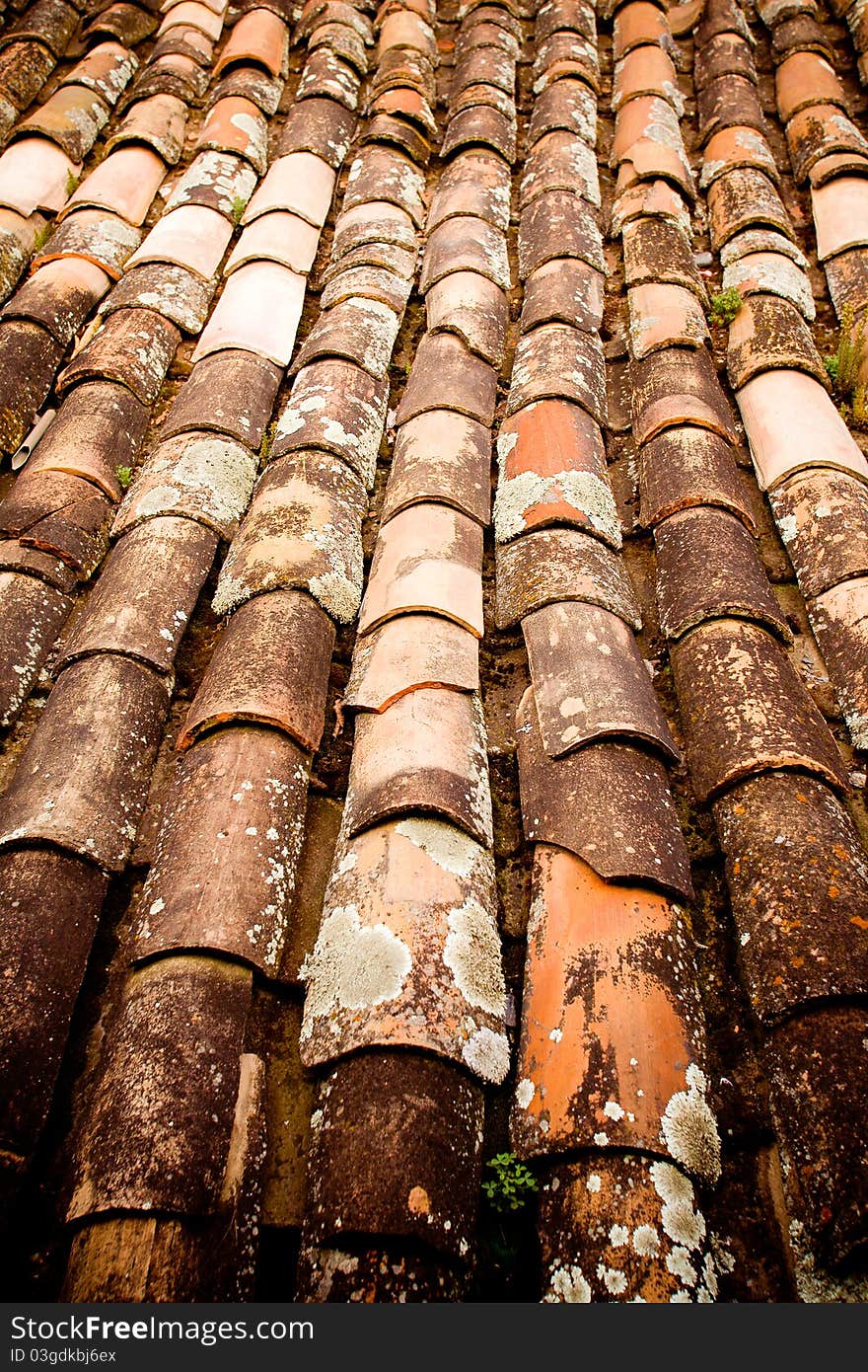 A close up of worn roof tiles