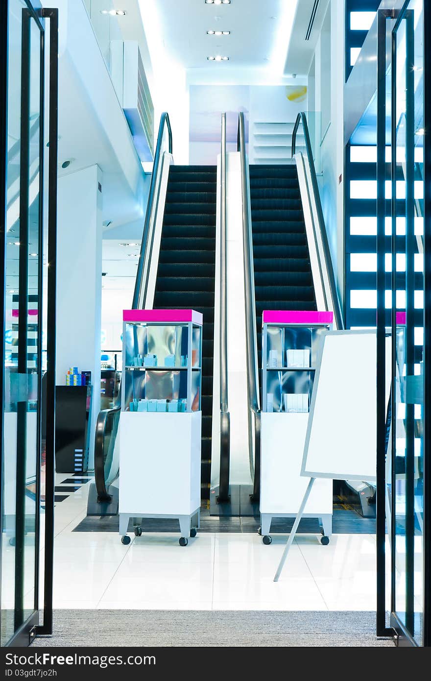 Entrance of a cosmetics shop with escalator