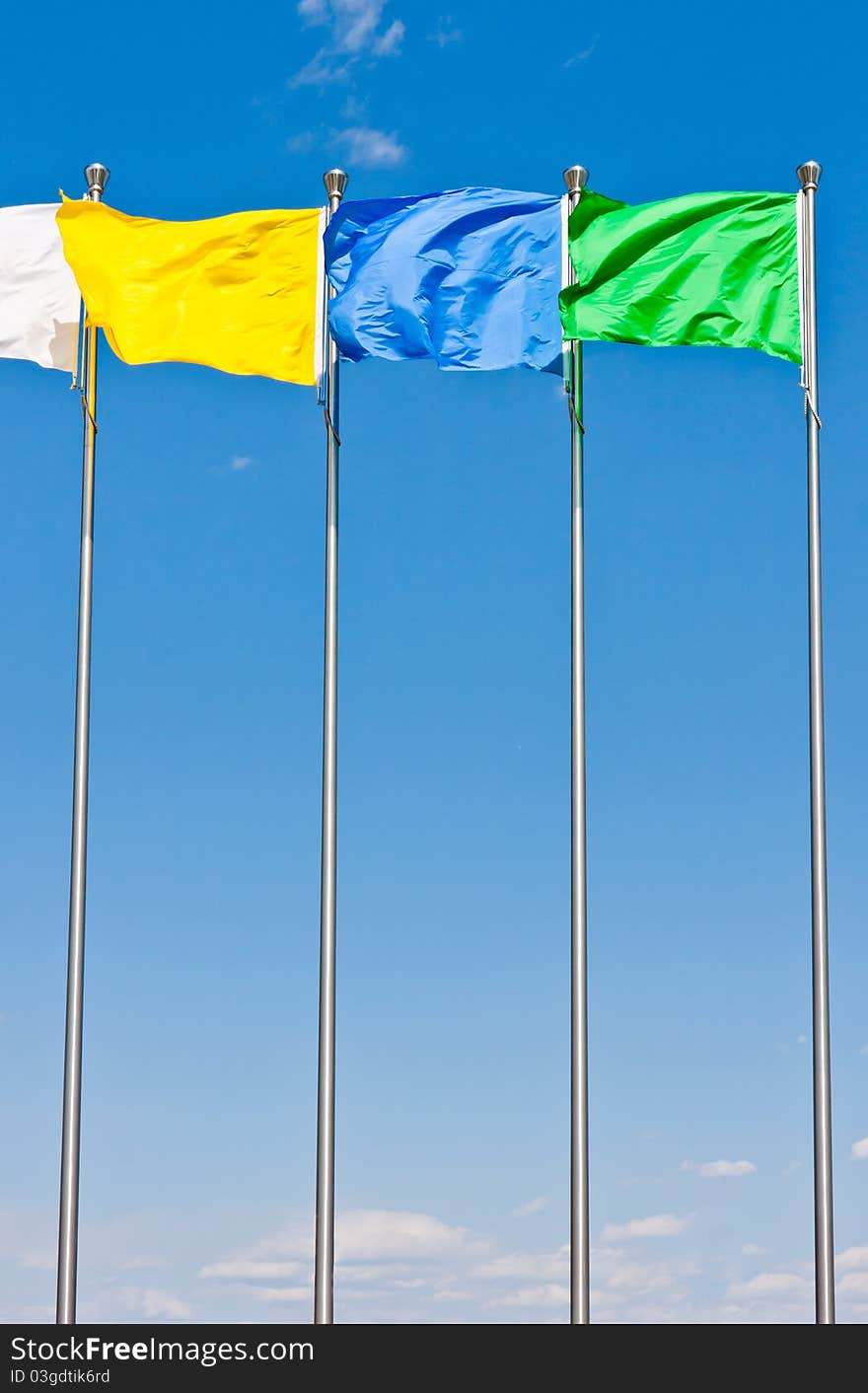 Four flying flag under blue sky