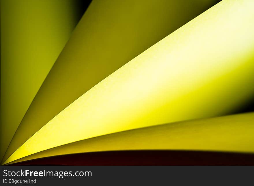 Yellow notepad paper illuminated by LED light with black back. Yellow notepad paper illuminated by LED light with black back