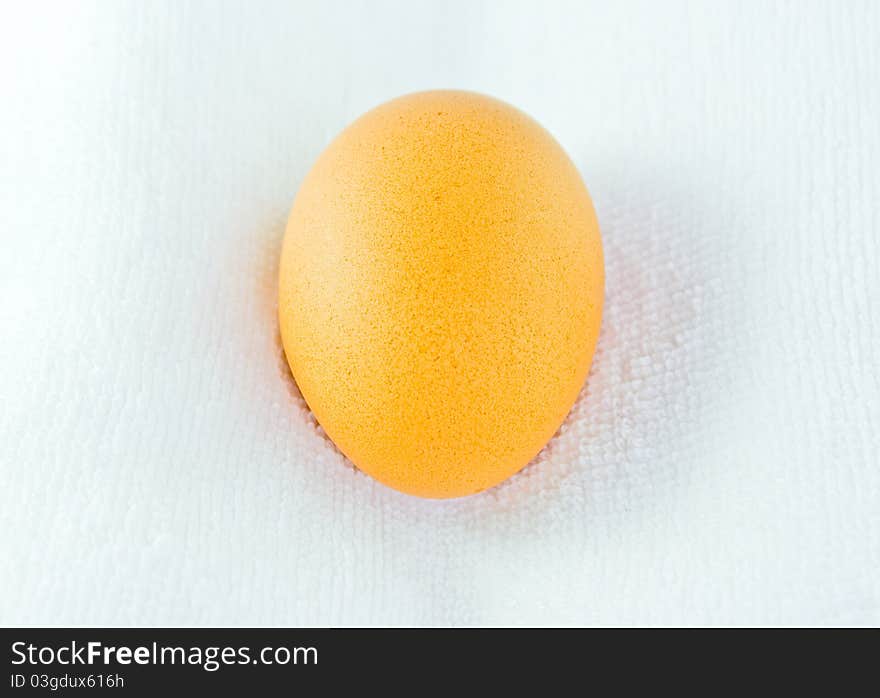 Close up an egg on white towel