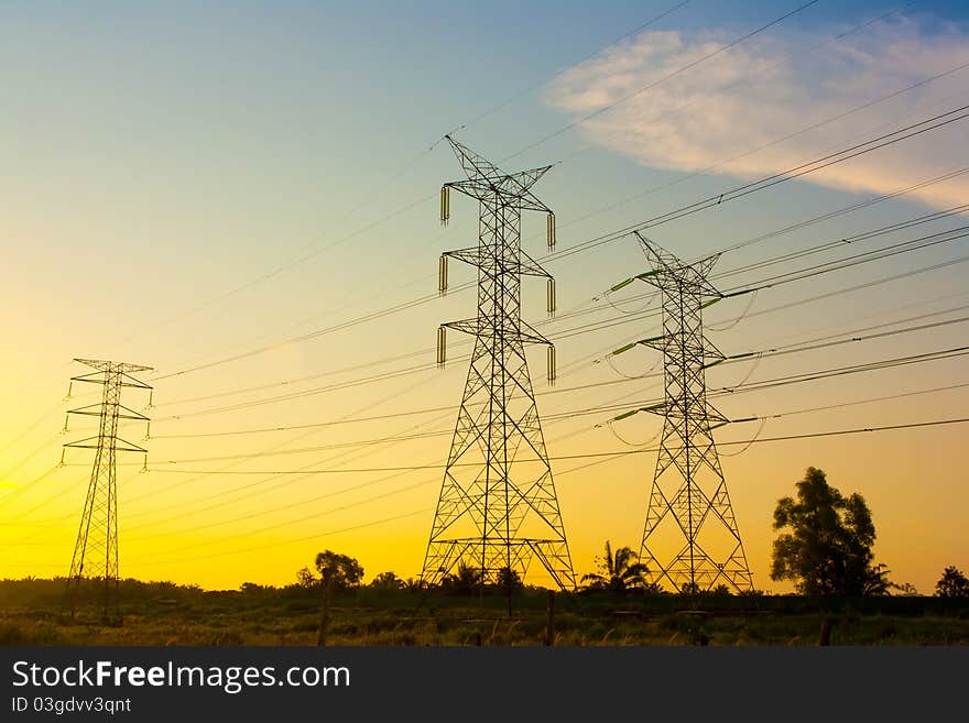 Electricity pylons at sunset