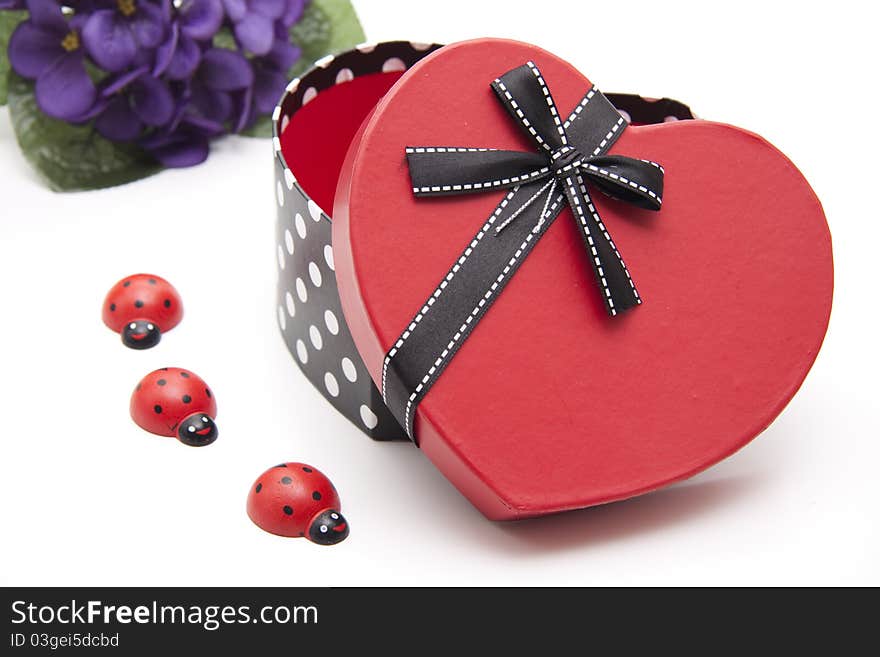 Love symbol with bow and ladybird