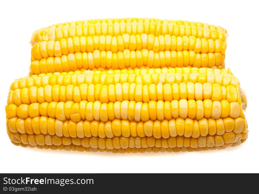 Corn-cob closeup isolated on white background with light shadow. Corn-cob closeup isolated on white background with light shadow