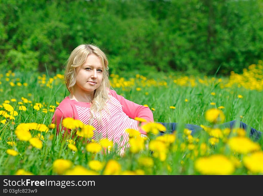 Young pretty woman on the green grass. Young pretty woman on the green grass