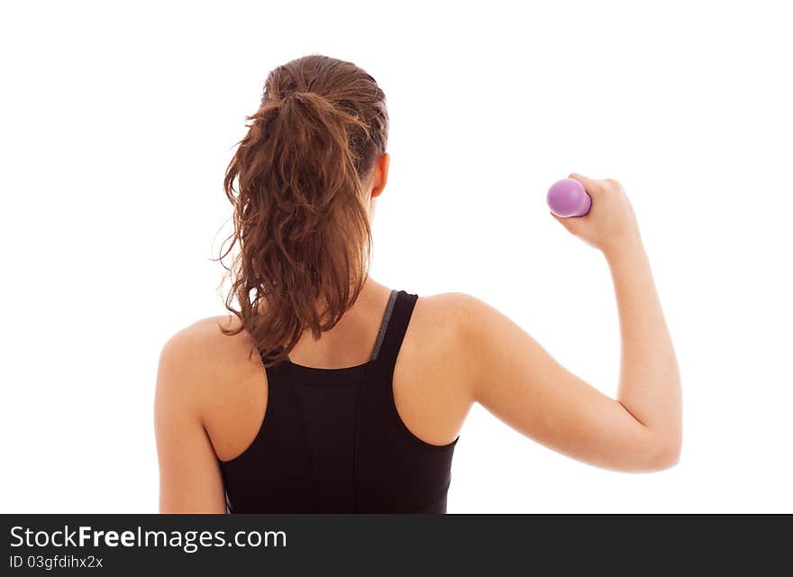 A young female dressed in black gym clothes holding a weight. A young female dressed in black gym clothes holding a weight