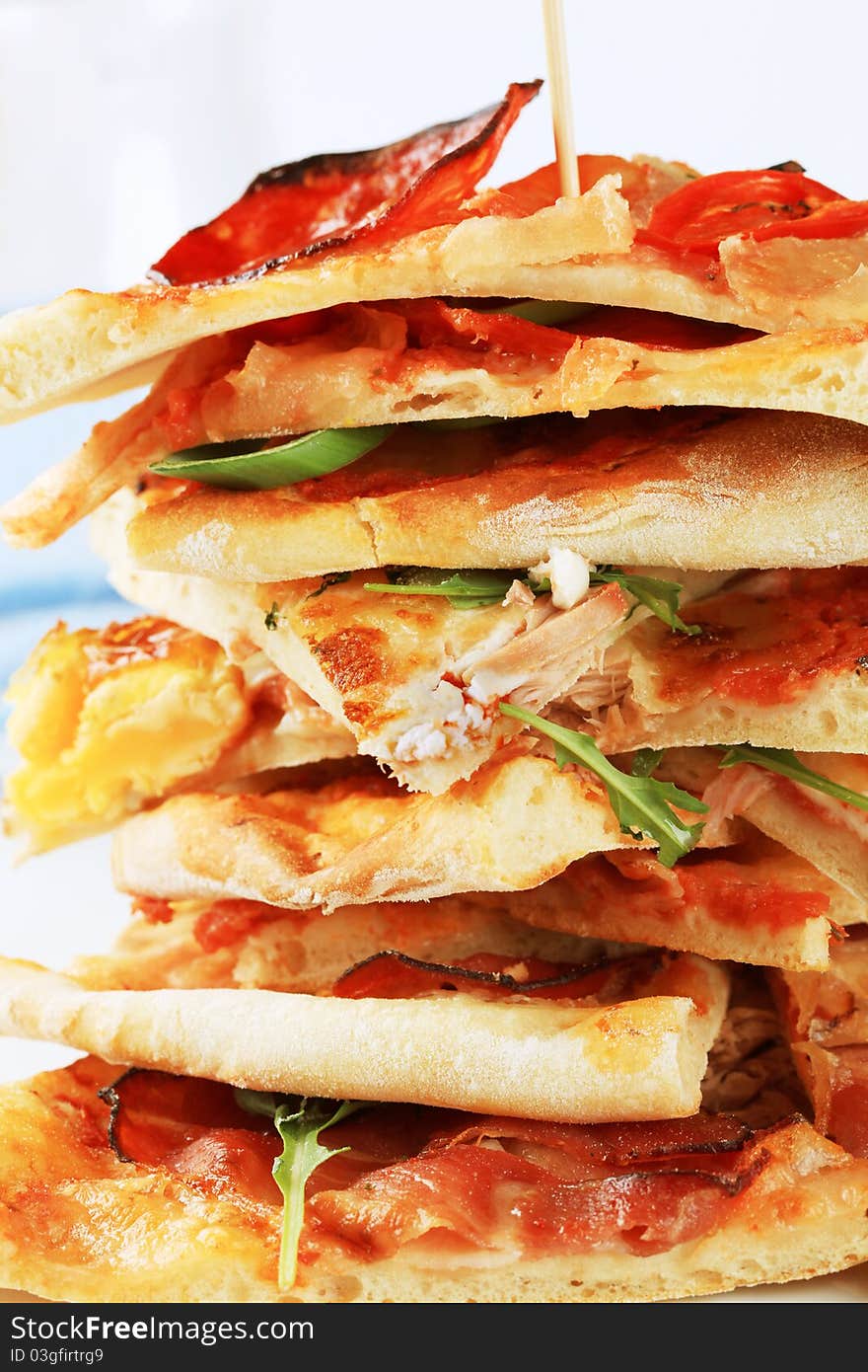 Stack of thin slices of pizza - detail