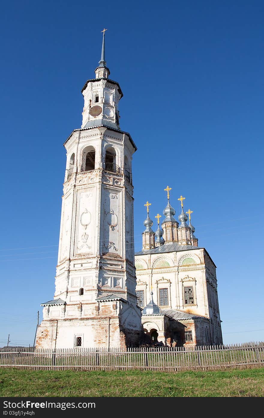 Ancient Bell Tower and the temple erected in the Russian north. Ancient Bell Tower and the temple erected in the Russian north