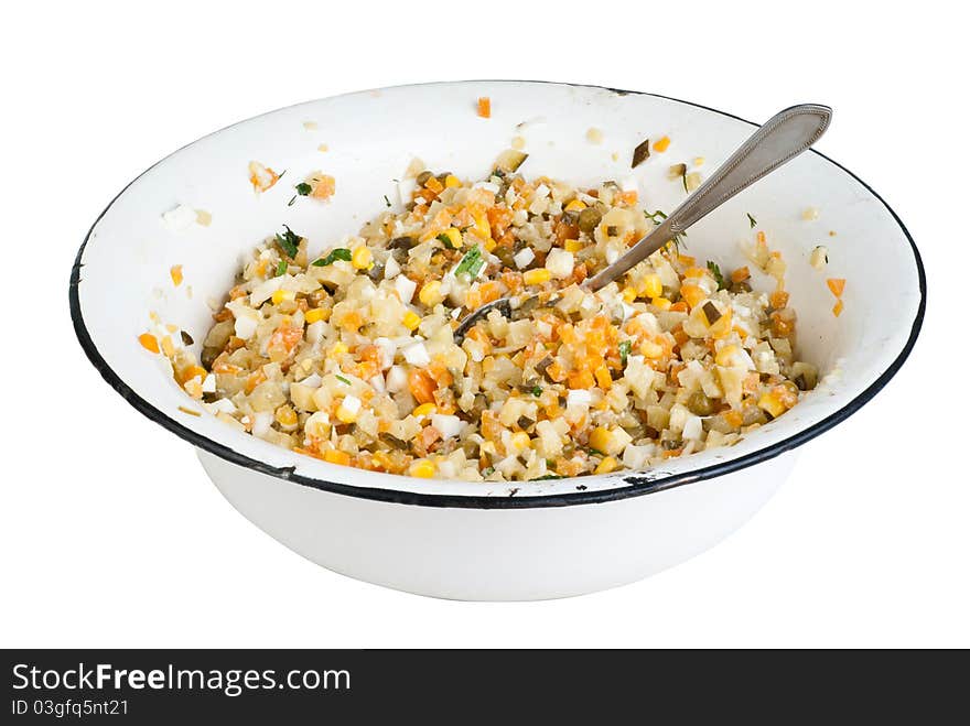 A traditional russian salad, isolated on white