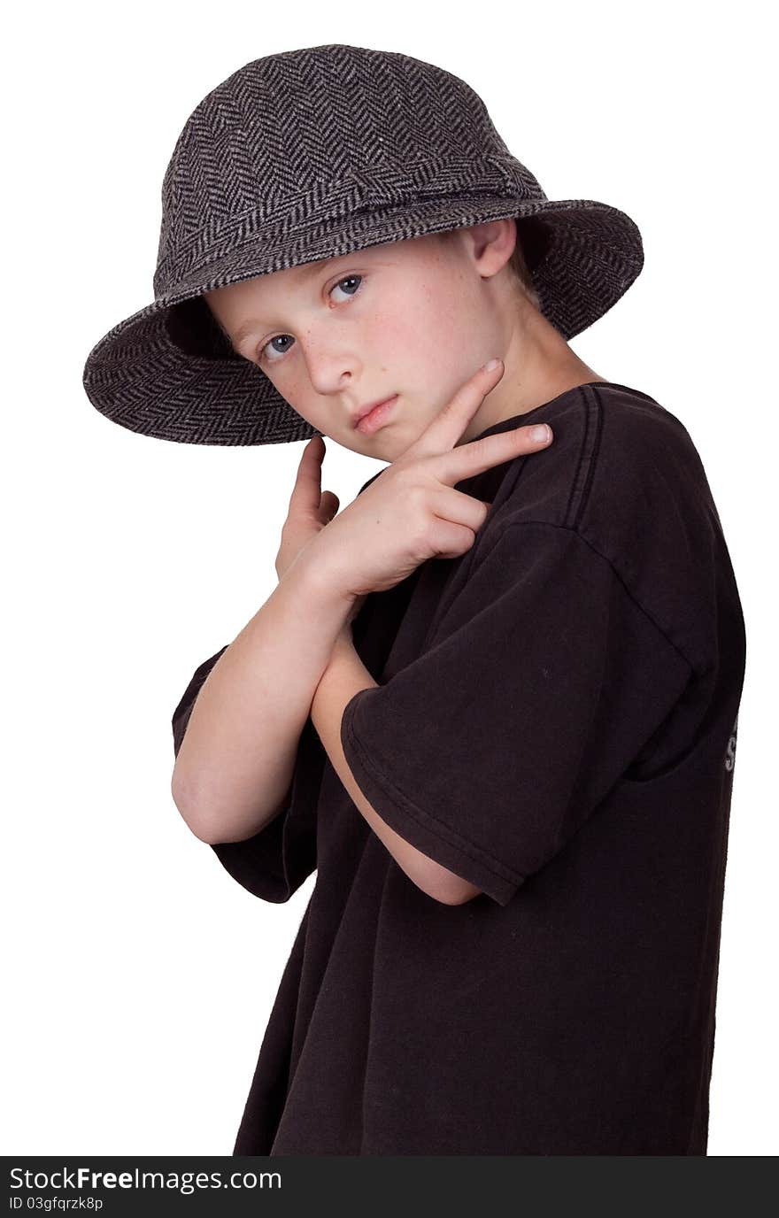 A photograph of a young boy with his arms crossed and holding a pease sign with his hands while wearing a grey hat. A photograph of a young boy with his arms crossed and holding a pease sign with his hands while wearing a grey hat.