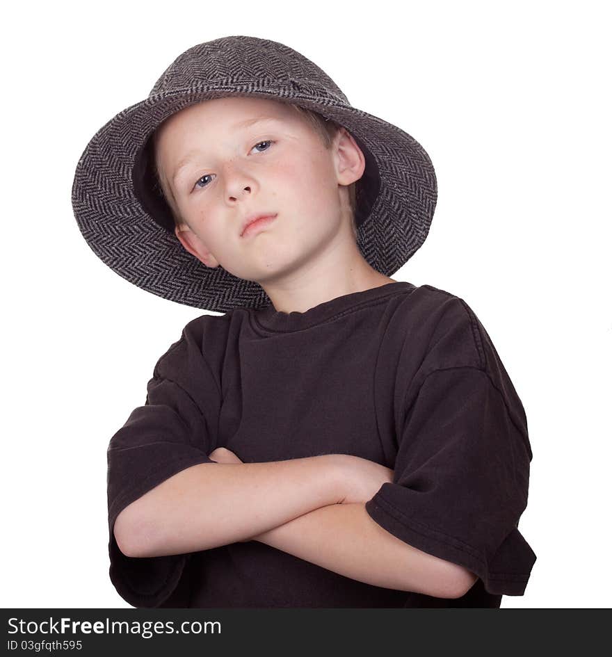 A photograph of a young boy standing tough while wearing a grey hat. A photograph of a young boy standing tough while wearing a grey hat.