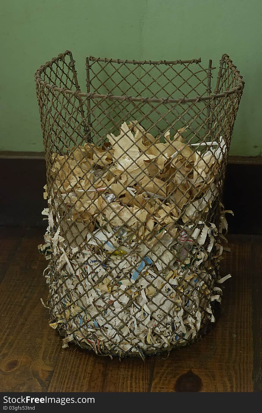 A dustbin filled with rubbish