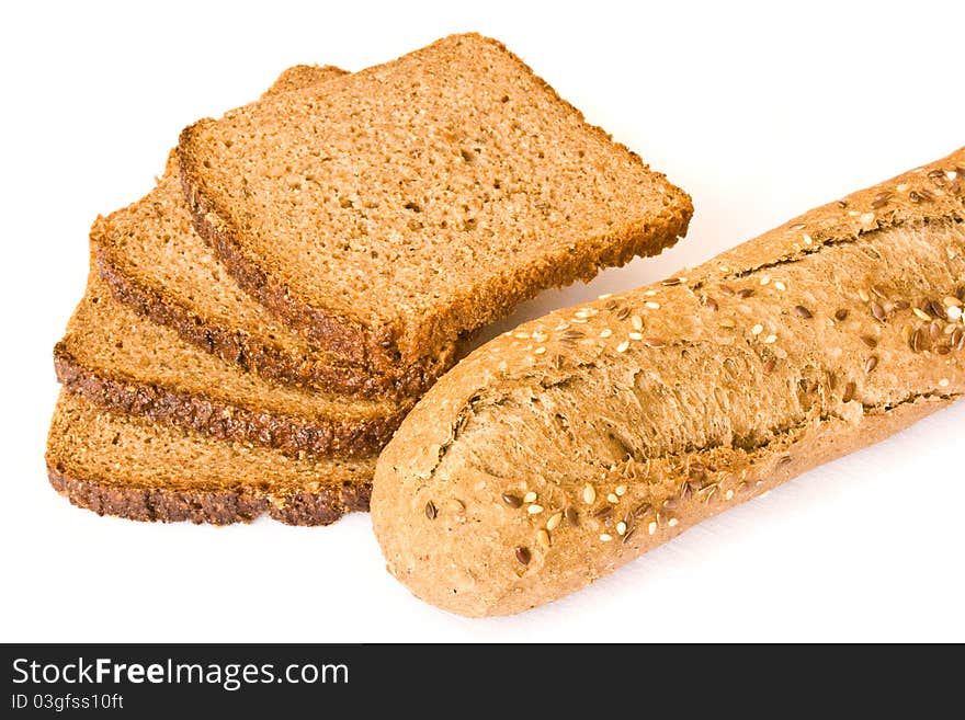 Slices of wholemeal bread and fitness baguette - healthy food isolated on white. Slices of wholemeal bread and fitness baguette - healthy food isolated on white