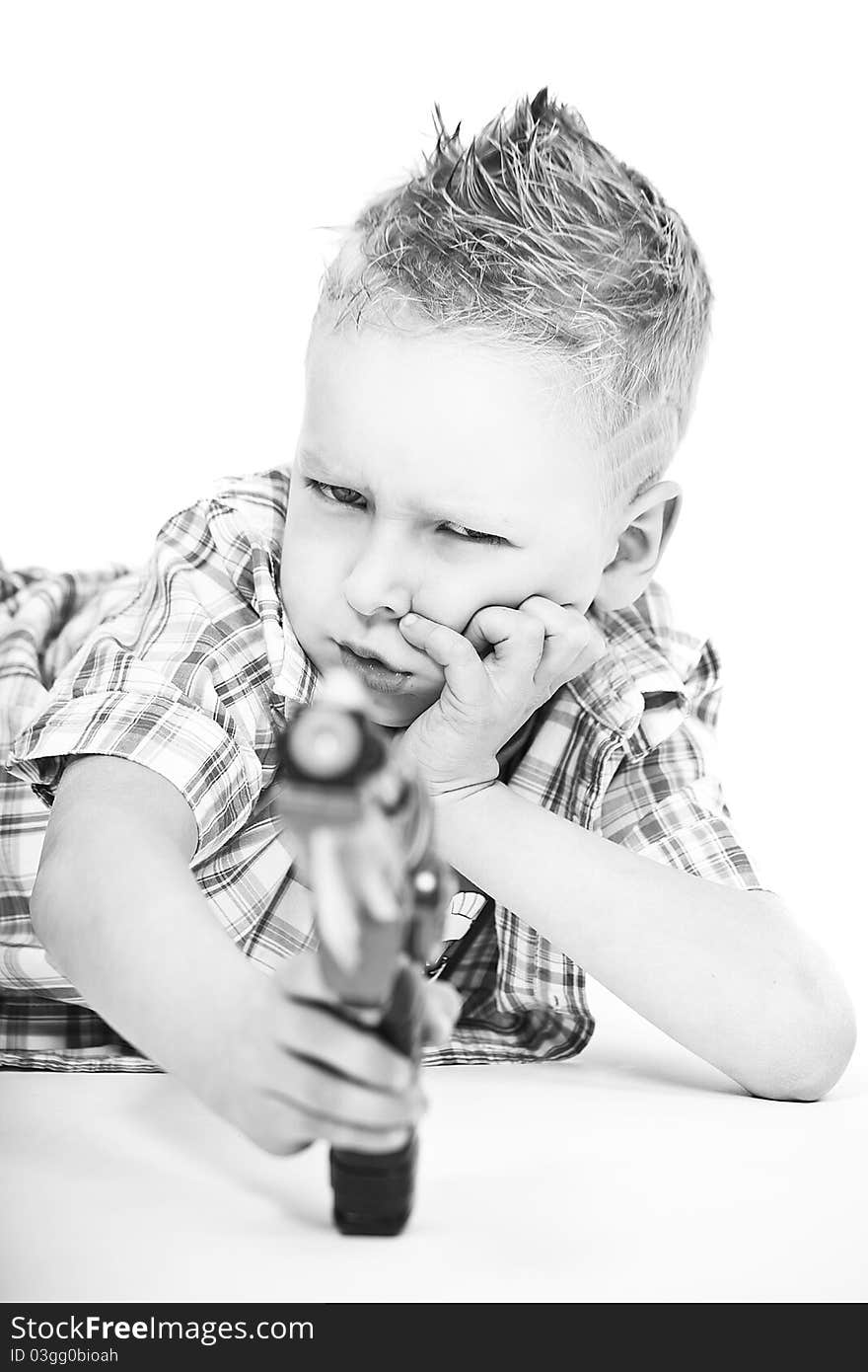 Boy with his toy gun on white background. Boy with his toy gun on white background