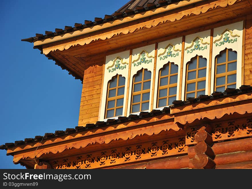 Wooden palace of Tsar Alexei Mikhailovich in Moscow in traditional Russian style at the background of a winter park. Wooden palace of Tsar Alexei Mikhailovich in Moscow in traditional Russian style at the background of a winter park.