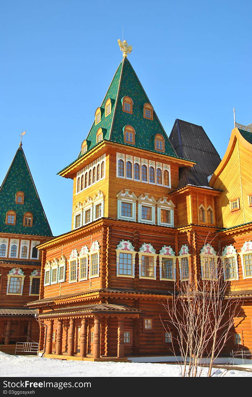 Wooden palace of Tsar Alexei Mikhailovich in Moscow in traditional Russian style at the background of a winter park. Wooden palace of Tsar Alexei Mikhailovich in Moscow in traditional Russian style at the background of a winter park.