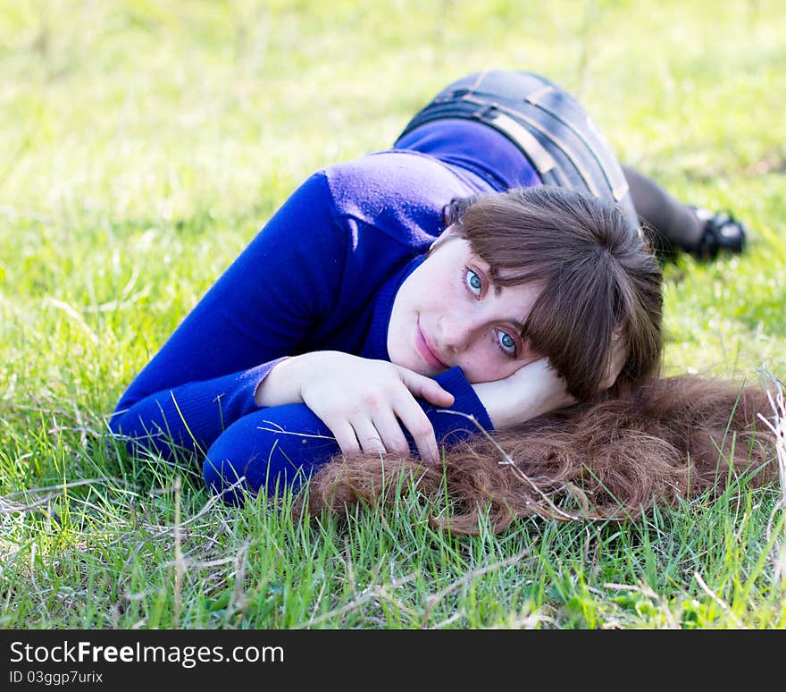 Single beautiful woman relaxing at the park. Single beautiful woman relaxing at the park