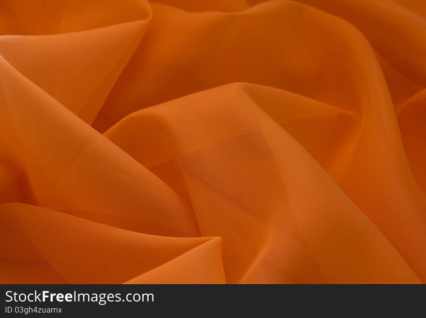 Abstract background from orange fabric. Abstract background from orange fabric