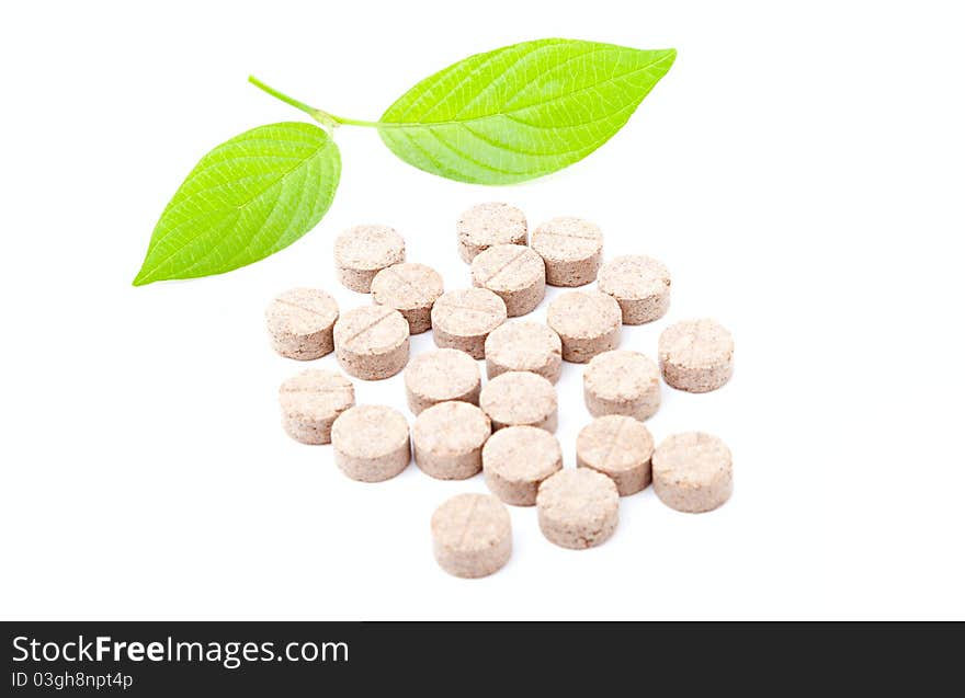 Pills with green leaf