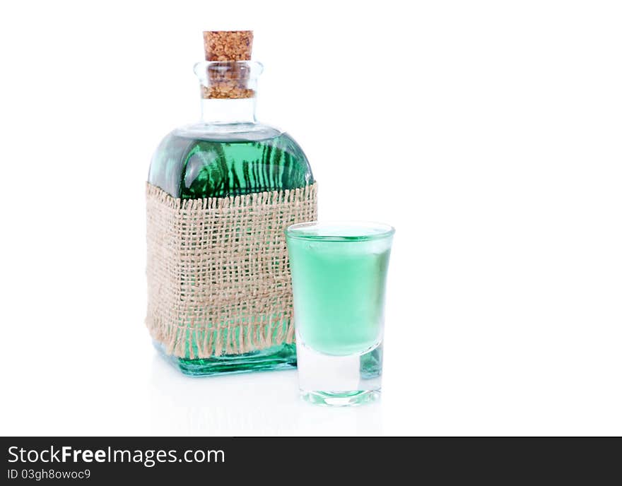 Glass of liqueur / mint drink and bottle. isolated on a white background. Glass of liqueur / mint drink and bottle. isolated on a white background