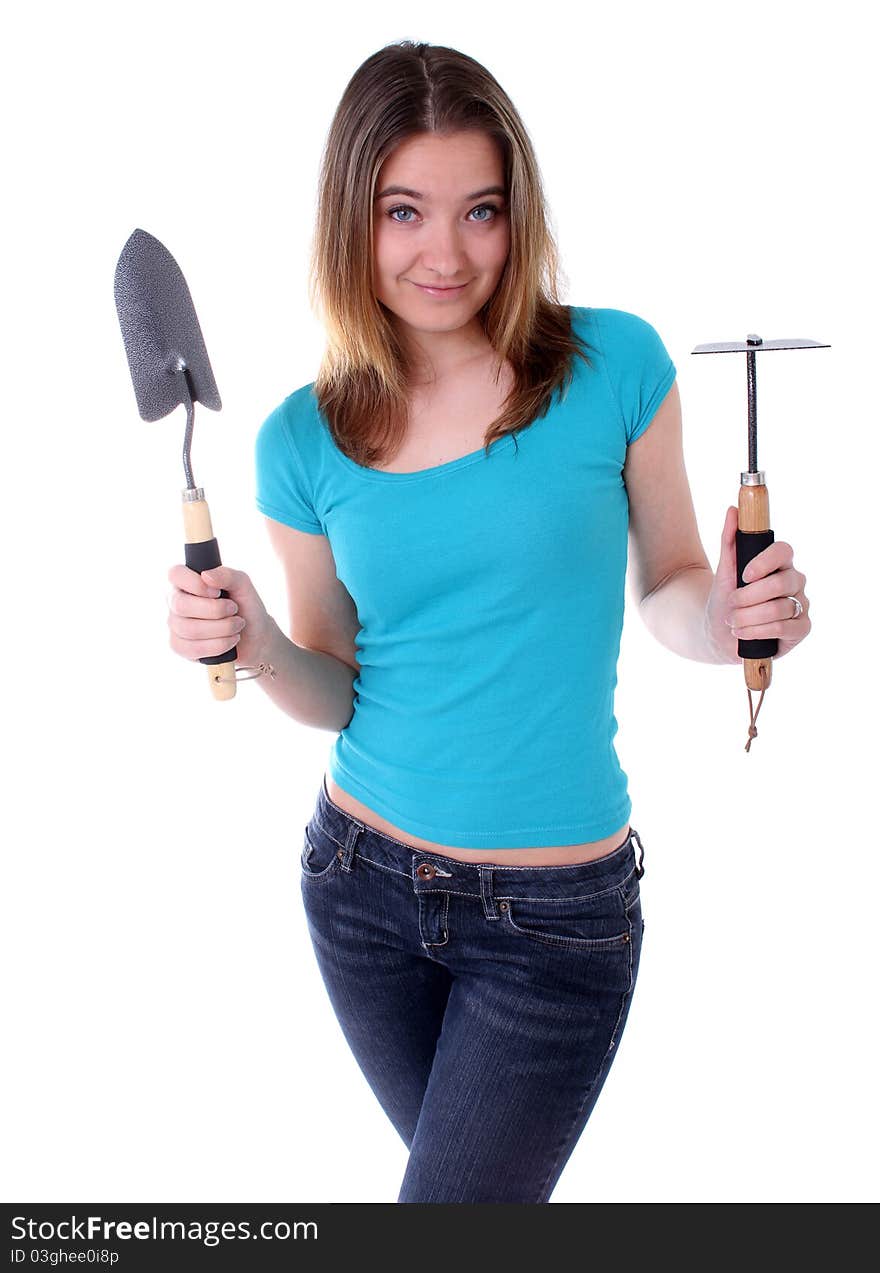 Woman holding a gardening shovel and hoe. Woman holding a gardening shovel and hoe