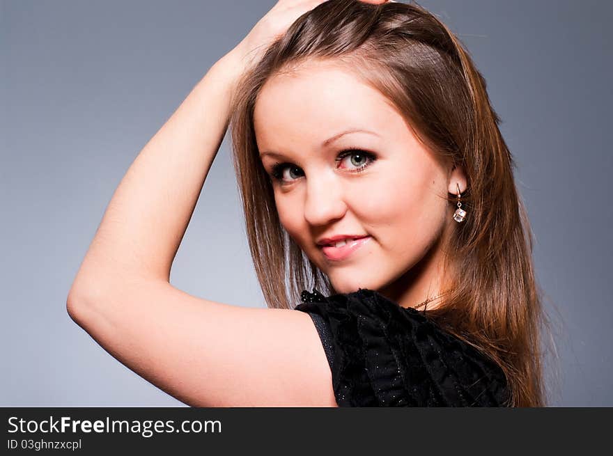 Studio portrait of a young beautiful girl smiling