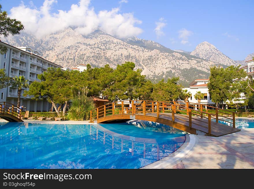 Pool in the open air against high mountains. Pool in the open air against high mountains