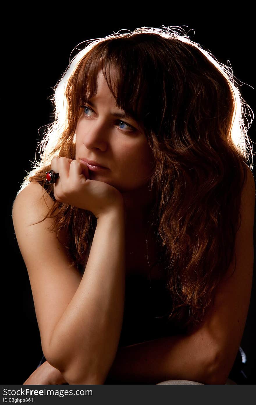 Woman portrait on black background in a studio