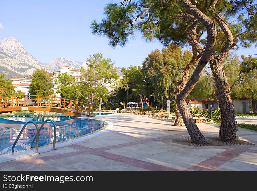 Pool in the open air against high mountains. Pool in the open air against high mountains