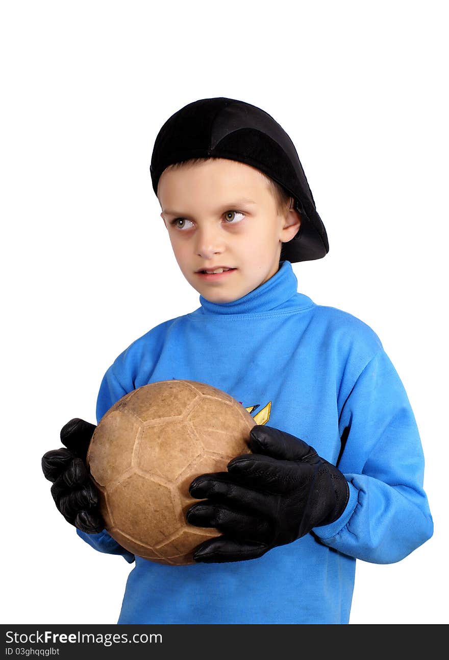 The boy with a ball in gloves a black cap. The boy with a ball in gloves a black cap.