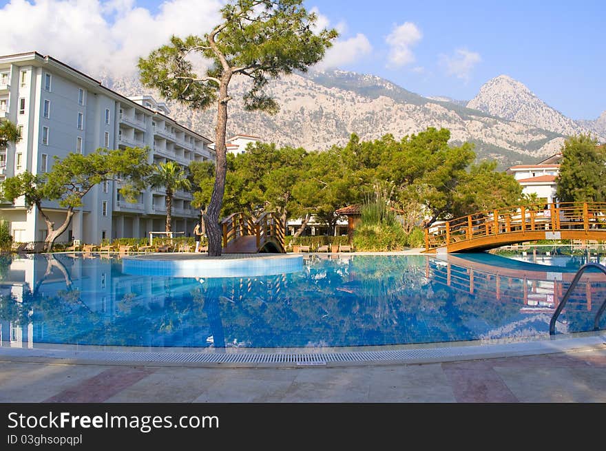 Pool in the open air against high mountains. Pool in the open air against high mountains