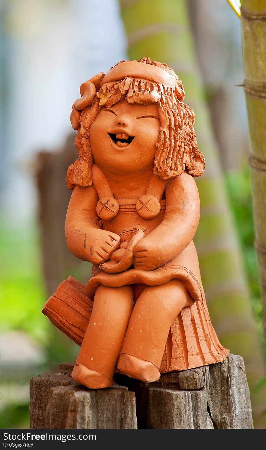 Pottery statuette of happy girl in the park