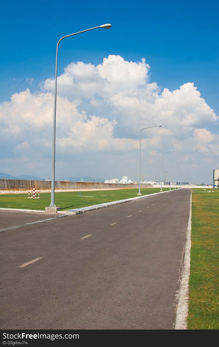 Empty asphalt road around the power generator plant one of the safety way in case of fire or accident