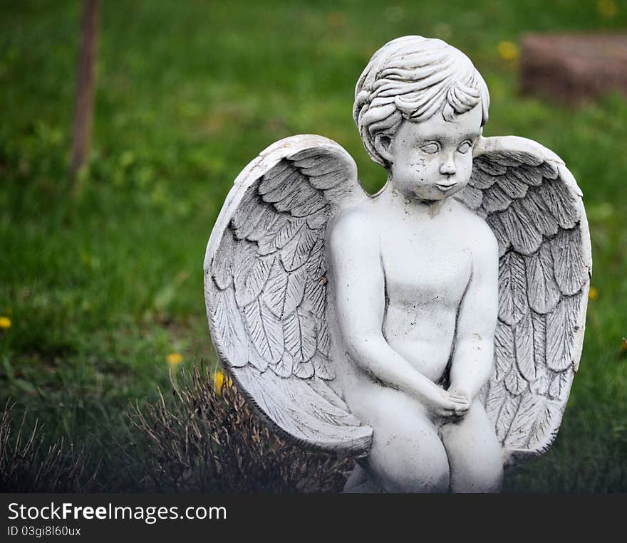 A stone angel child found in a cemetary