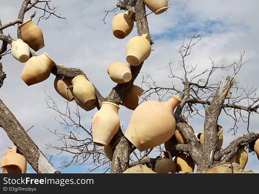 The earthenware objects on the tree.