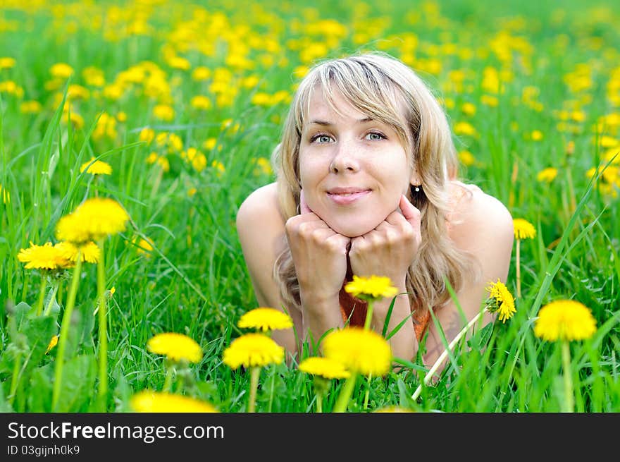 Blonde woman on the grass