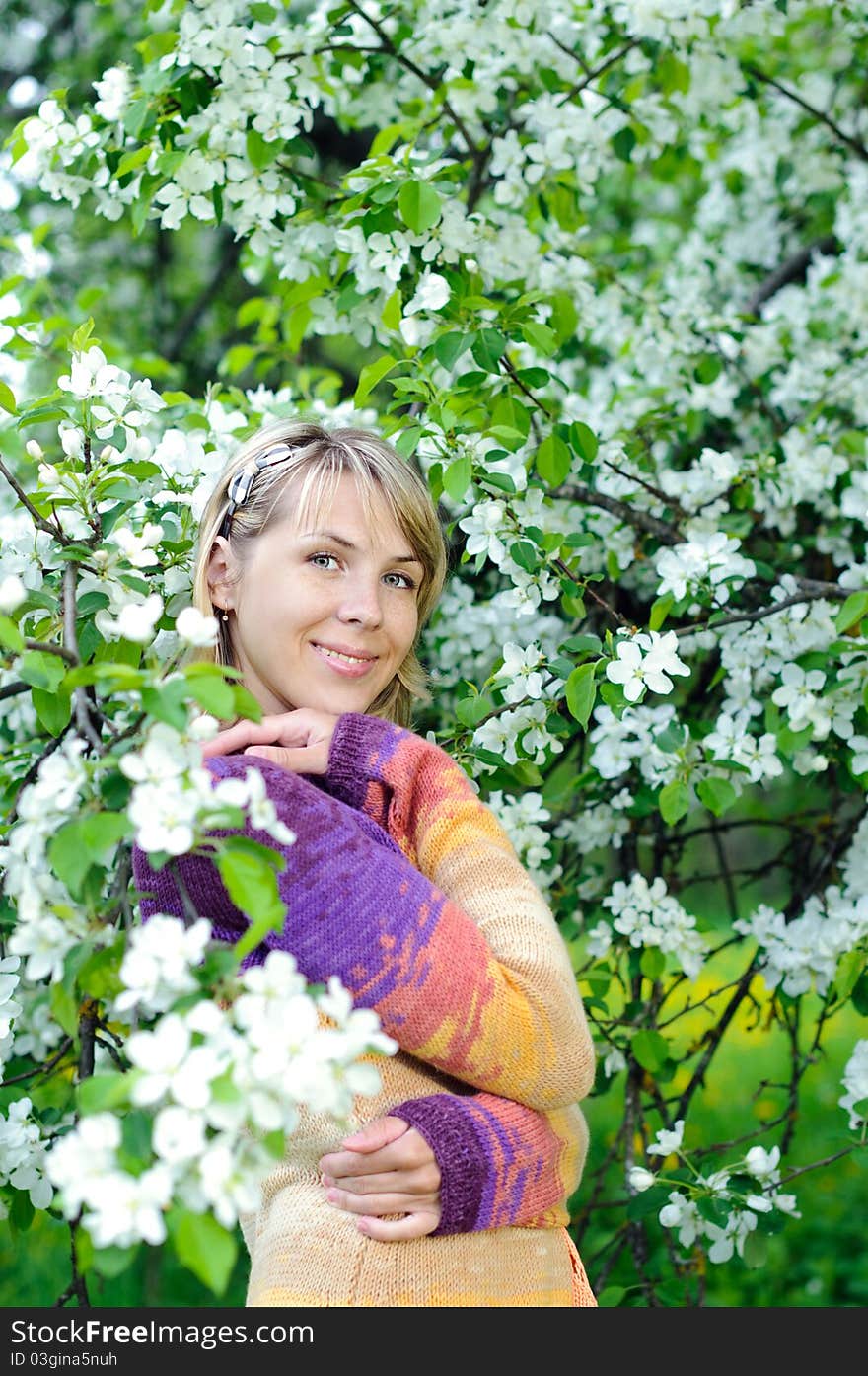 Woman in the blooming tree