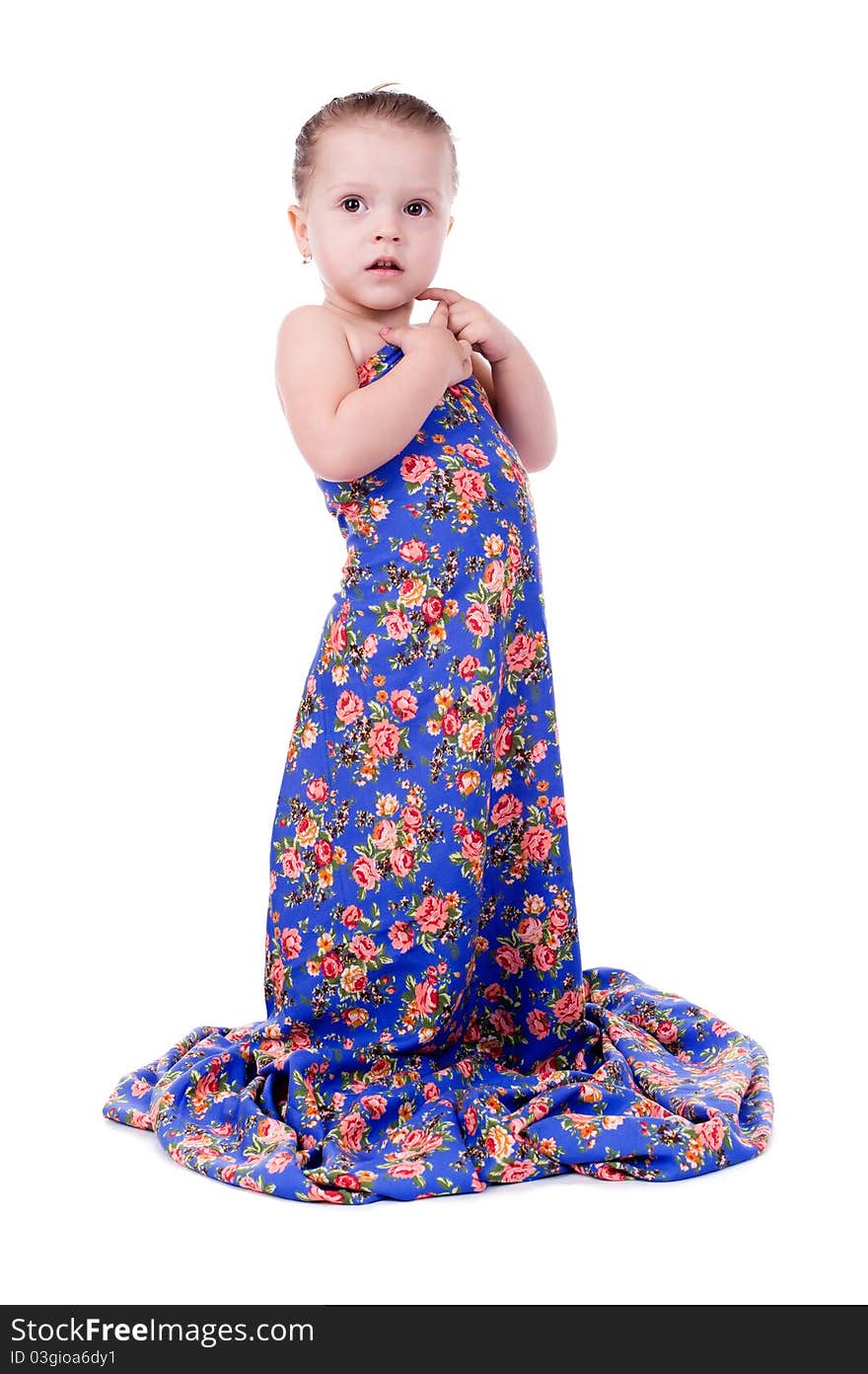 Little girl in a bright dress isolated on a white background.