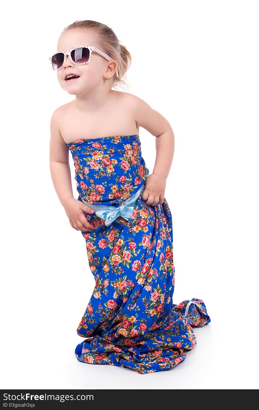 Little girl in a bright dress isolated on a white background.