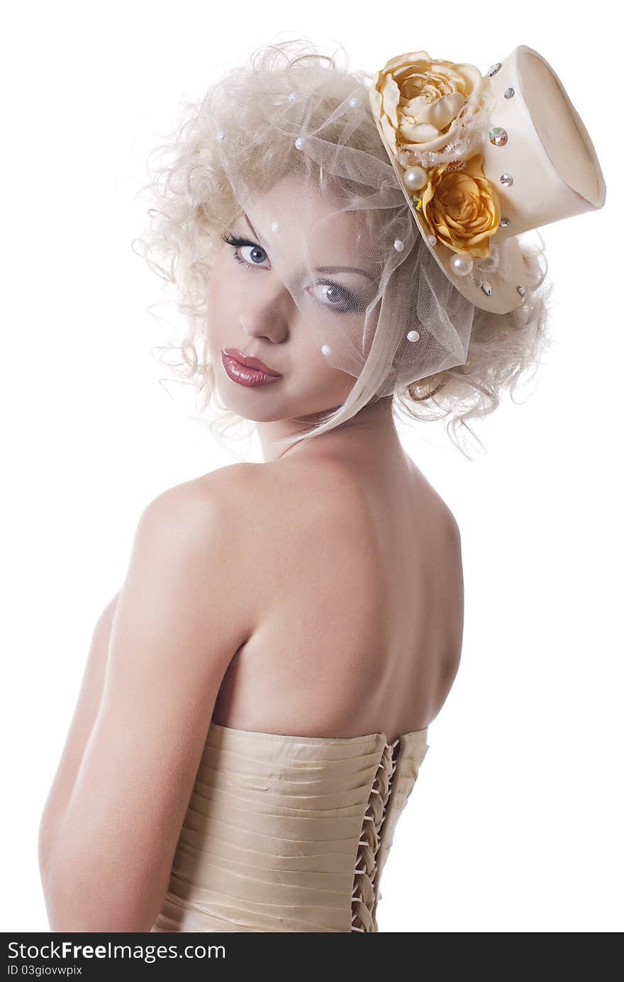 Portrait of blonde girl in a hat with a veil on a white studio background. Portrait of blonde girl in a hat with a veil on a white studio background