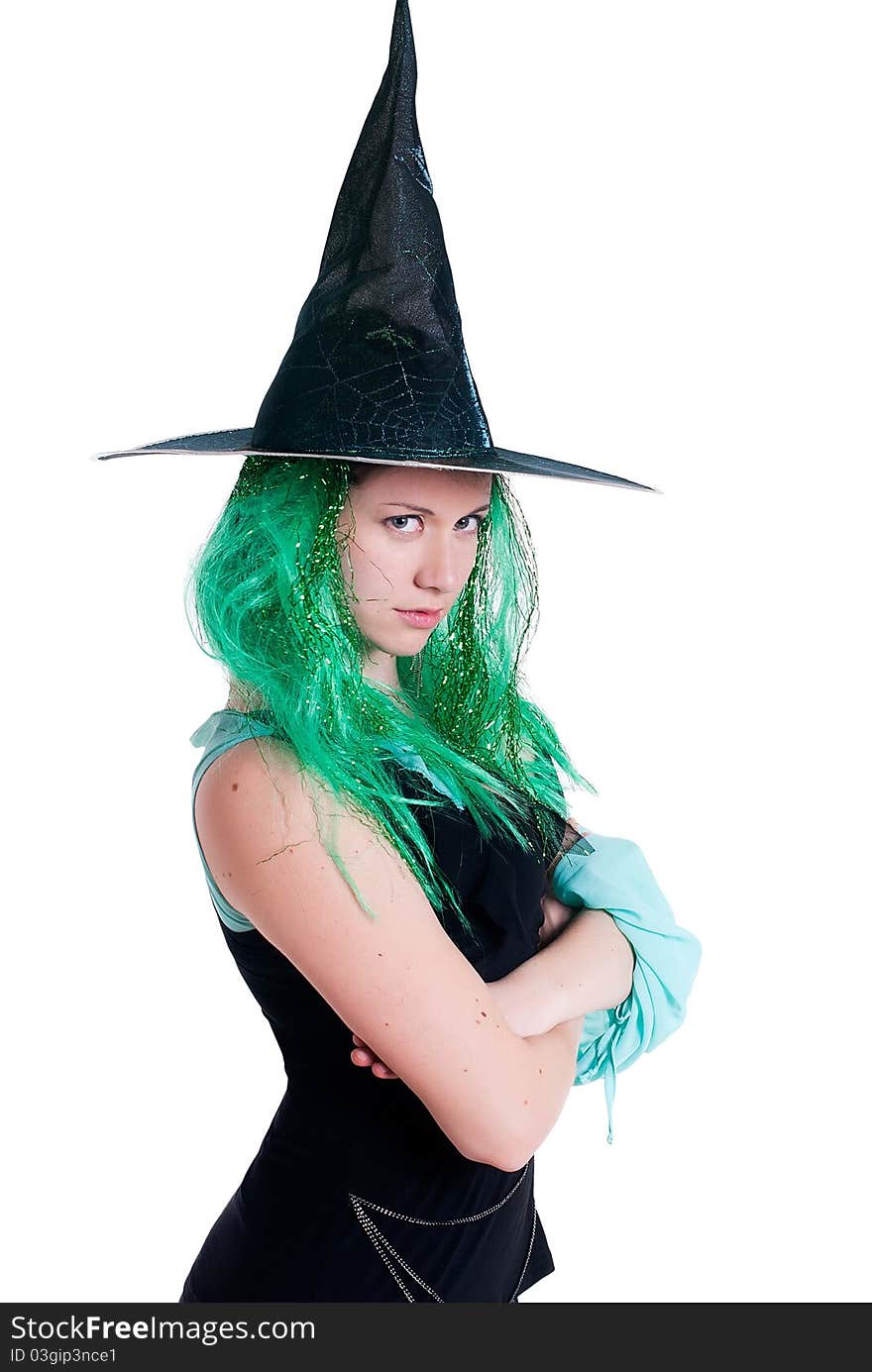 Portrait of a girl dressed as a witch isolated on a white background