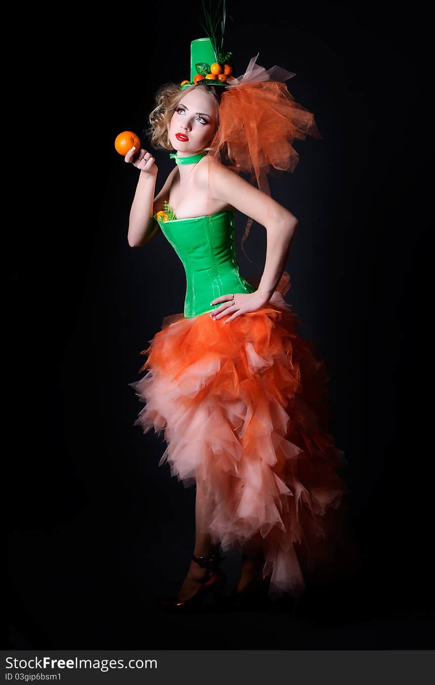 Full-length portrait of a woman with fashion makeup on a black background