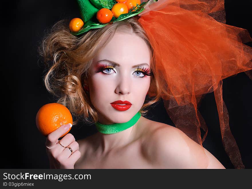 Portrait of a girl with fashion makeup on a black background