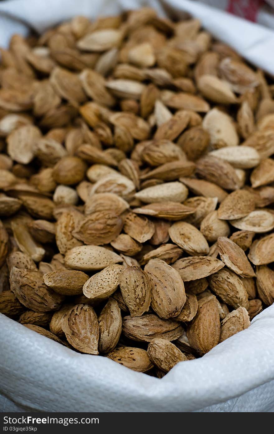 A bag full of almonds in their shells in a spice and dry goods store in Nazareth, Israel.