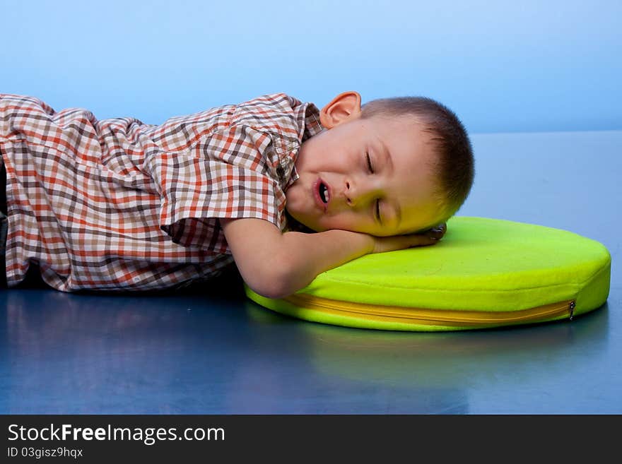 Cute boy sleeping on a pillow