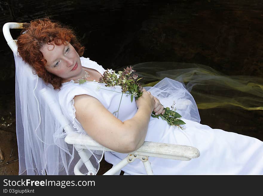 A bride waits by the ocean for her suitor. A bride waits by the ocean for her suitor.