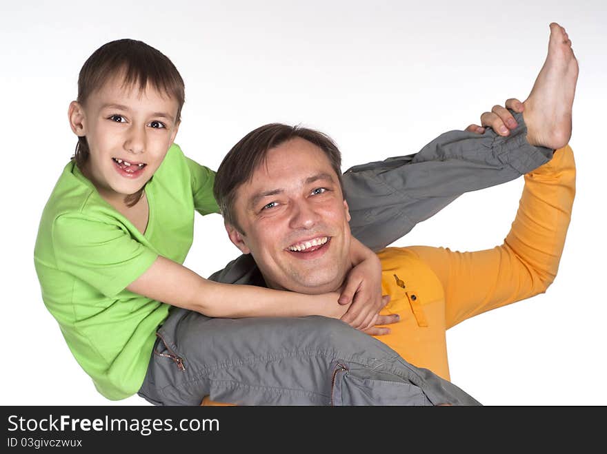 Happy dad and his son standing on a white background. Happy dad and his son standing on a white background